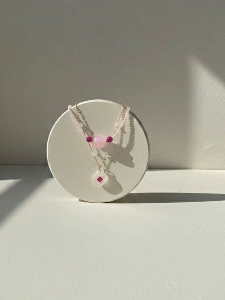 Ruby and rose quartz pendant necklace, detail of the layering pendant