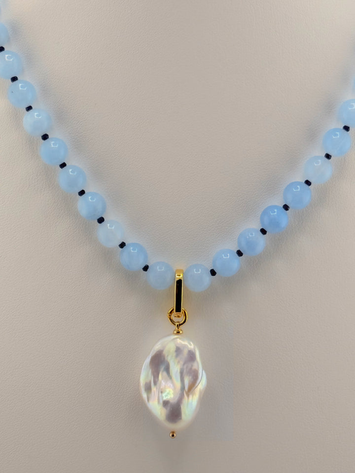Close-up of the pale aquamarine beads, blue jade accents and baroque pearl
