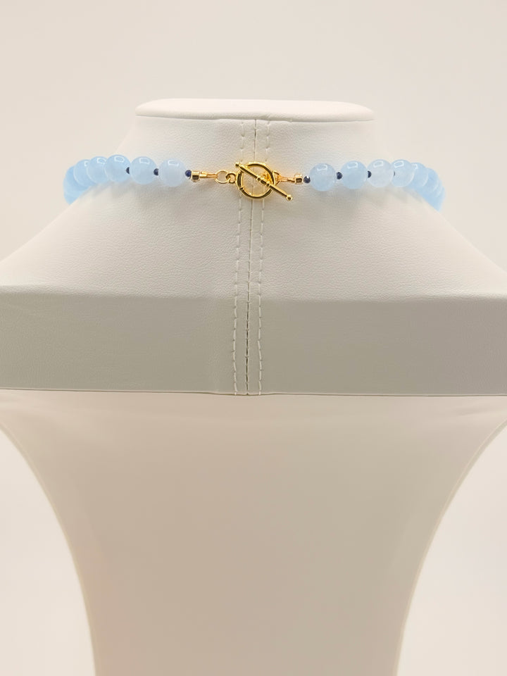 Toggle clasp detail on the aquamarine and blue jade necklace with 18k gold-plated accents