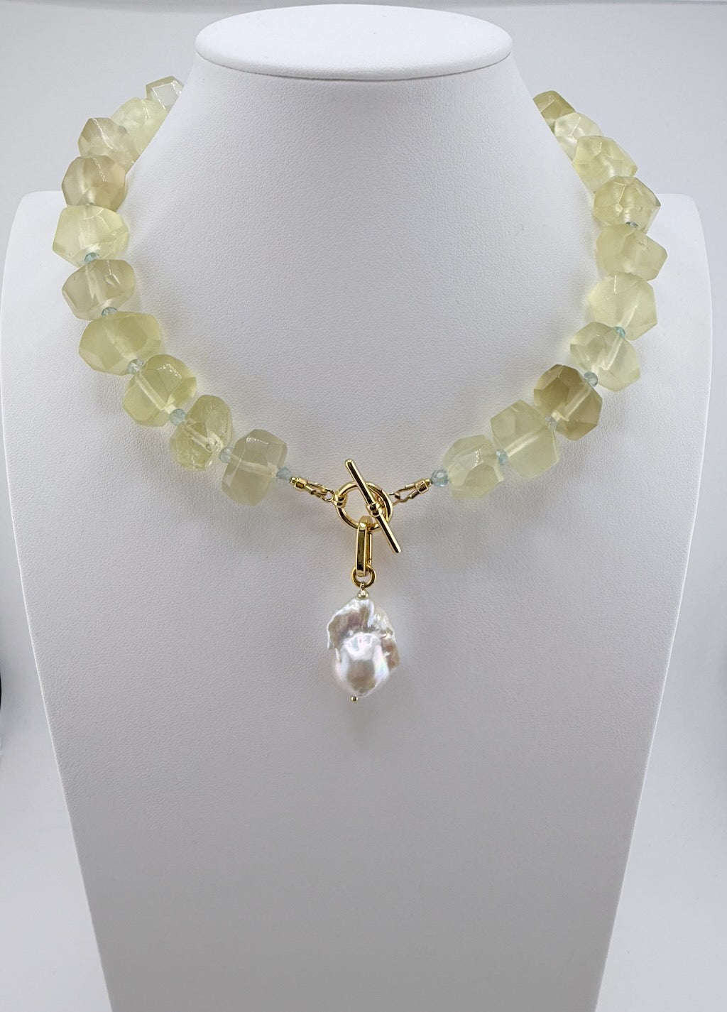 Lemon quartz nugget and blue topaz statement necklace with a removable baroque pearl drop and silver-plated details