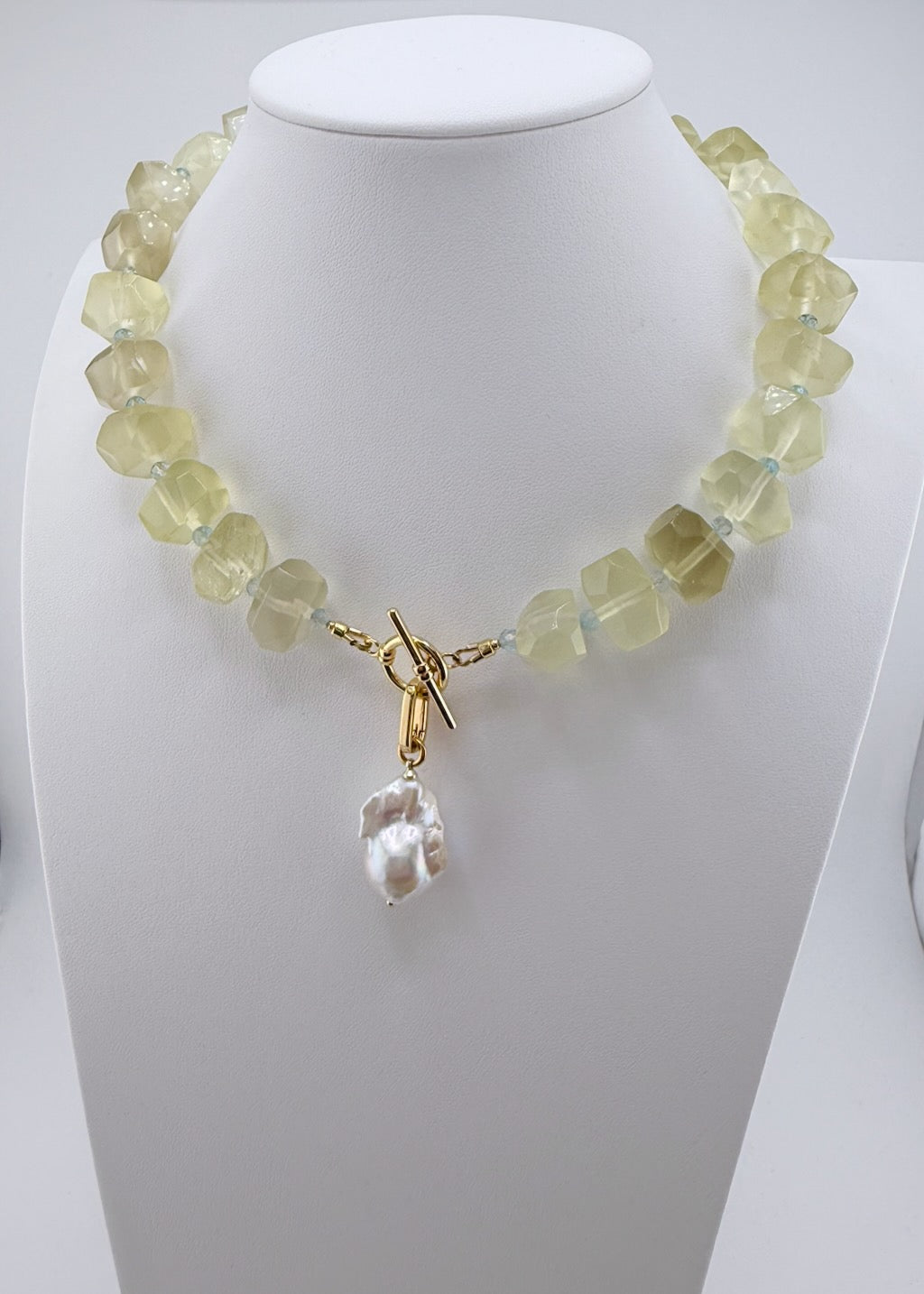Lemon quartz nugget necklace with faceted blue topaz accents and a baroque pearl drop
