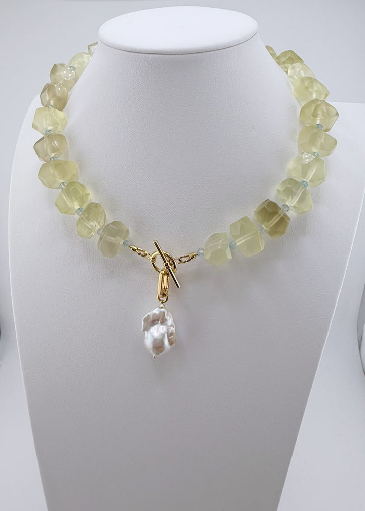 Lemon quartz nugget necklace with faceted blue topaz accents and a baroque pearl drop
