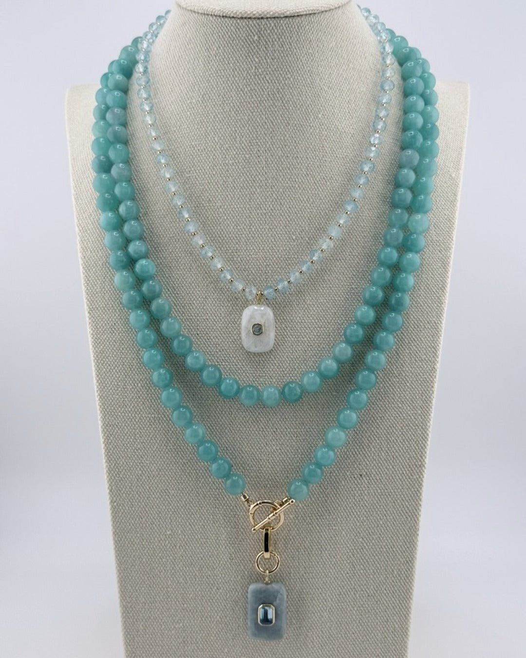 Amazonite long necklace styled layered with a shorter amazonite pendant necklace on a bust
