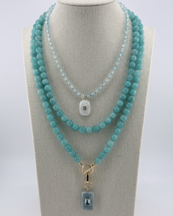 Amazonite long necklace styled layered with a shorter amazonite pendant necklace on a bust