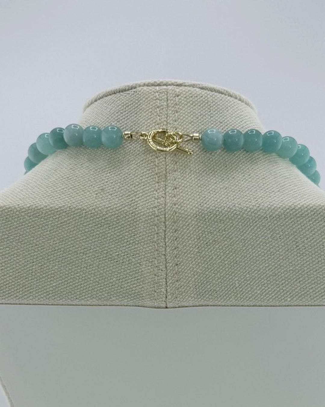 Back view showing the 18k gold-plated toggle clasp on the amazonite necklace