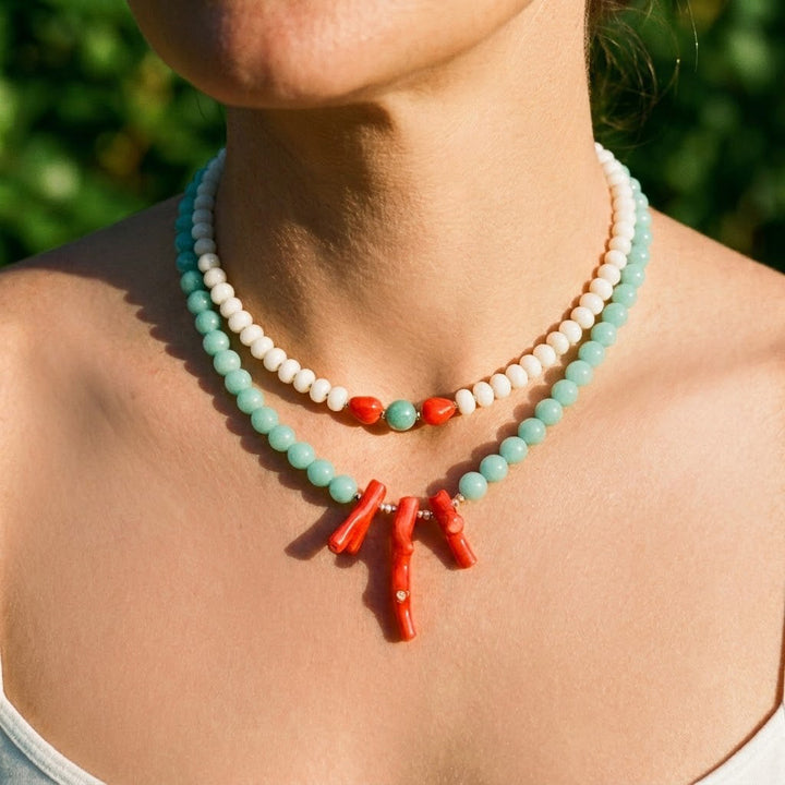 layered look pairing the amazonite and coral necklace with a white jade and coral necklace