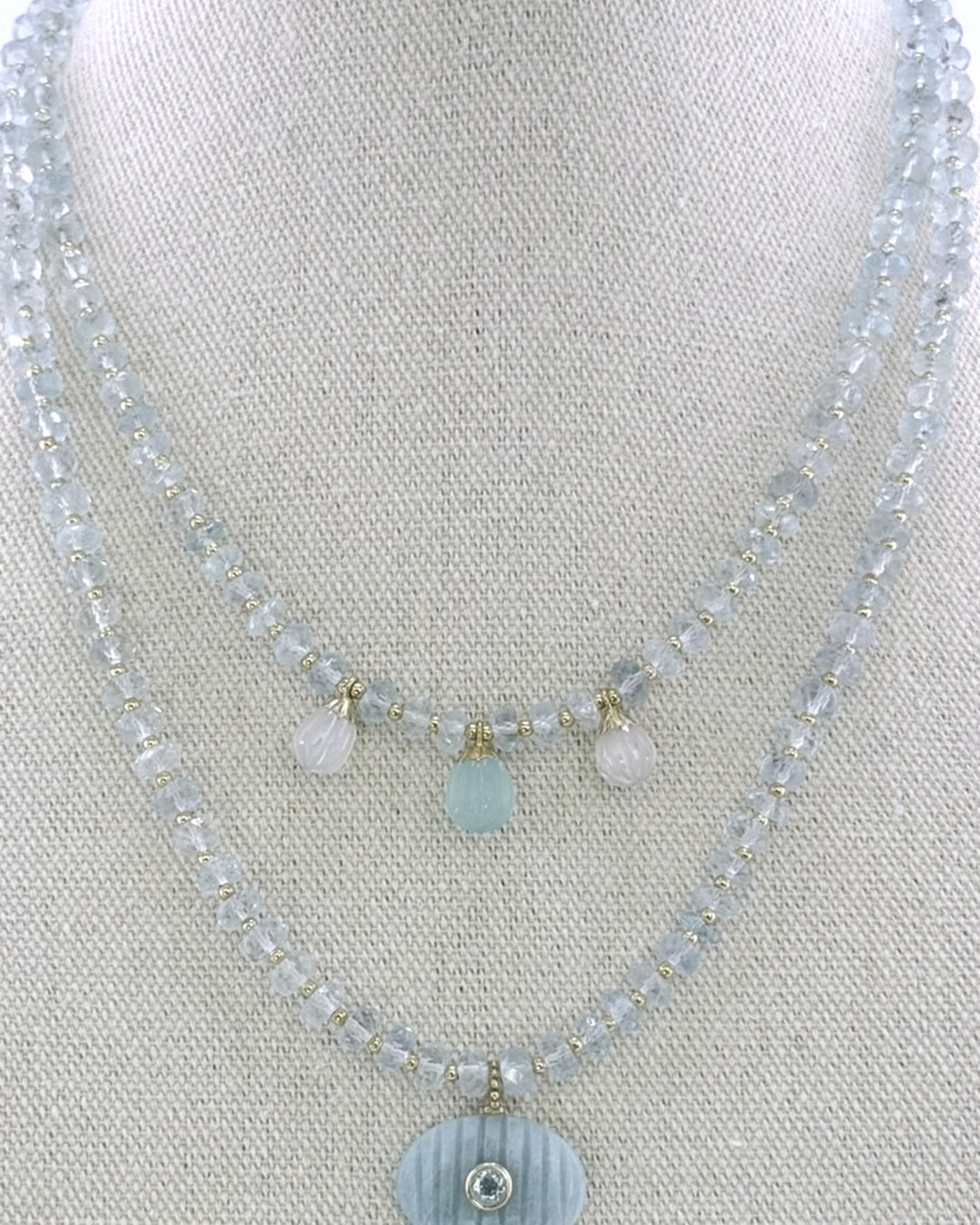 The aquamarine drops necklace styled layered with a longer amazonite pendant necklace