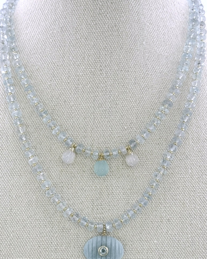 The aquamarine drops necklace styled layered with a longer amazonite pendant necklace