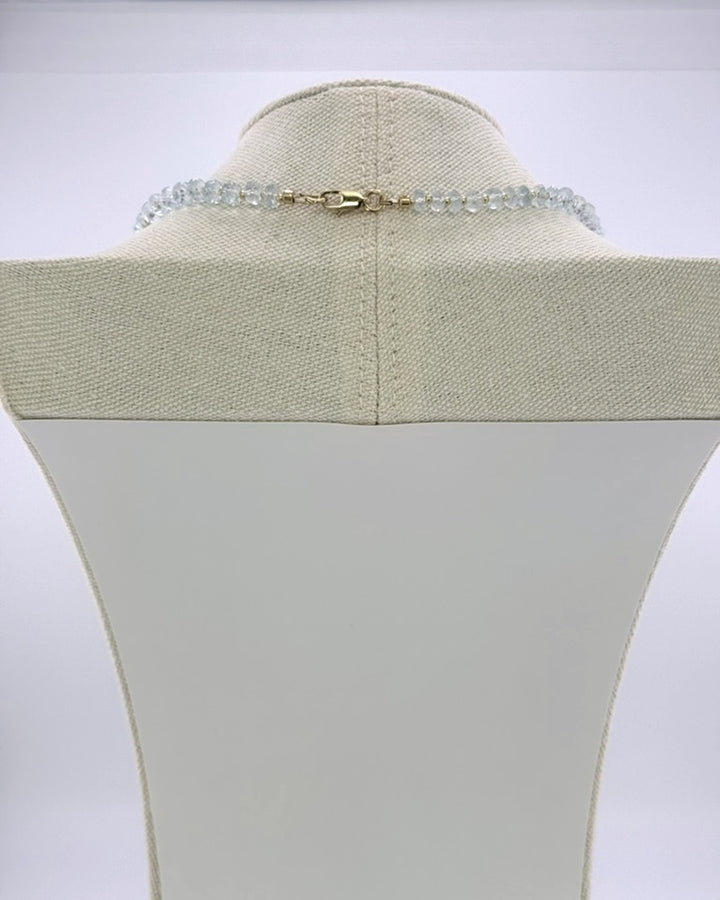 Back view showing the 18k gold-plated lobster clasp on the aquamarine drops necklace