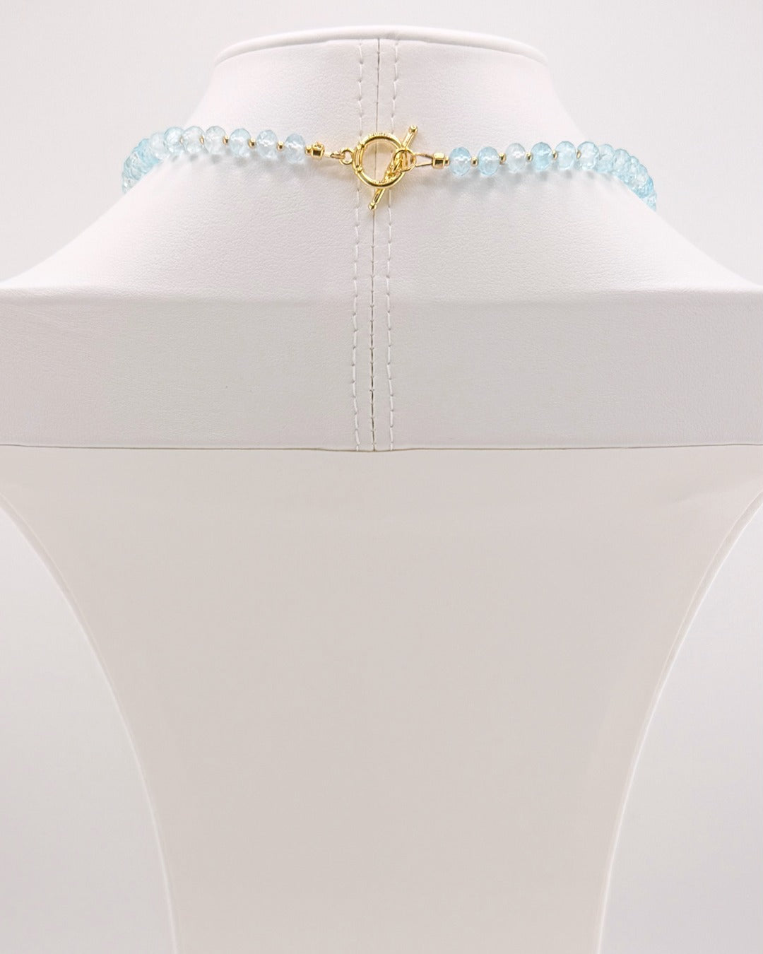 Gold clasp on the blue topaz and moonstone pendant necklace