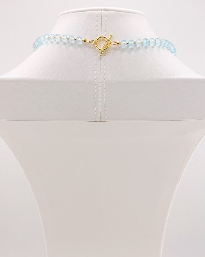 Gold clasp on the blue topaz and moonstone pendant necklace