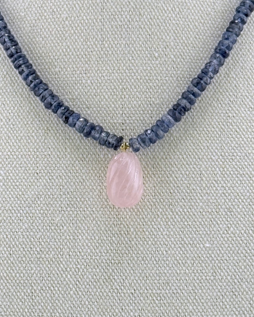 Close-up macro of the translucent faceted navy kyanite beads