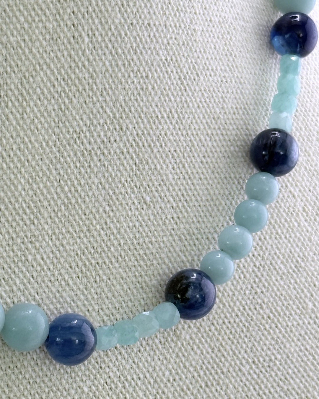 Close view of the amazonite and kyanite beads showing the aqua and navy stones