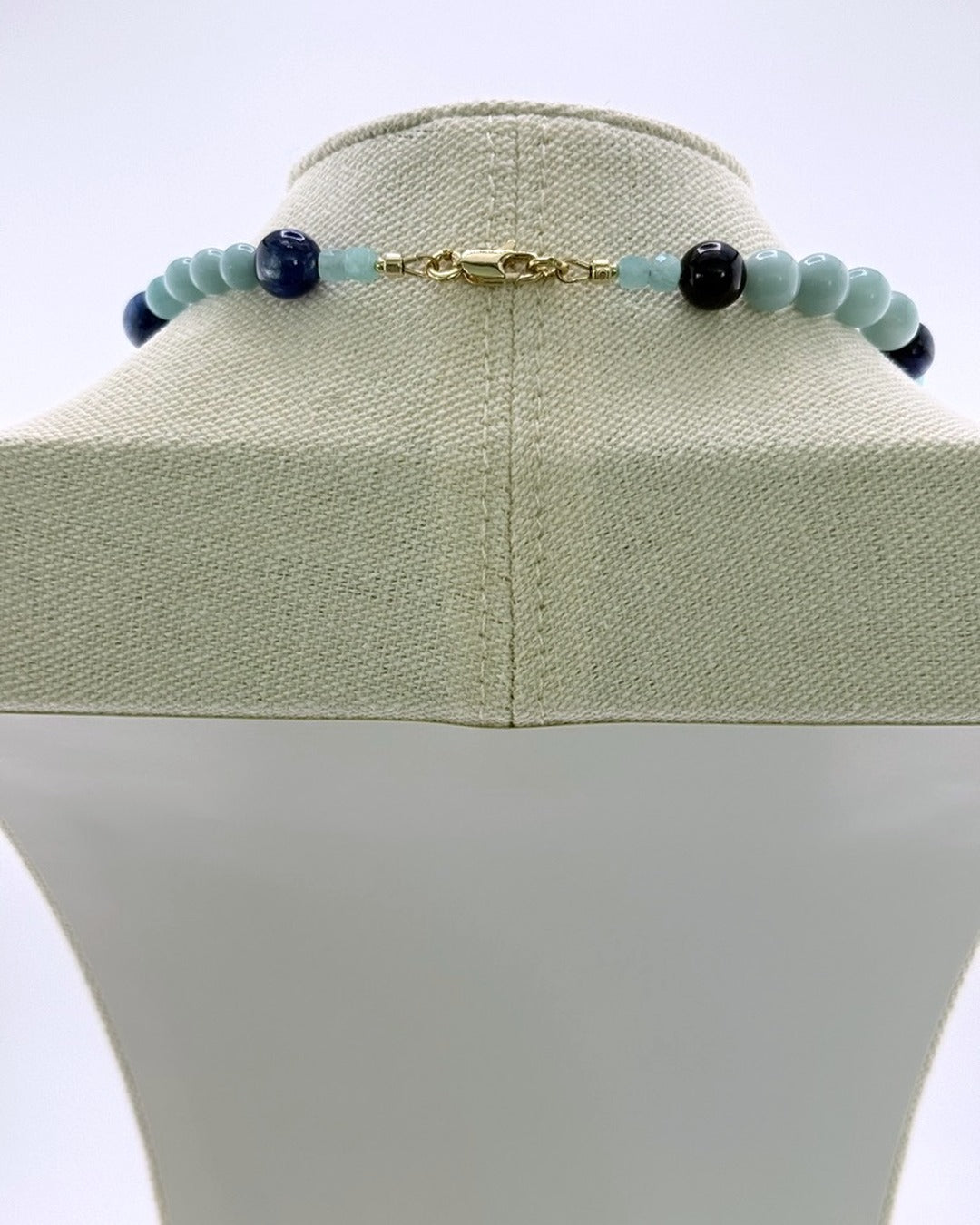 Gold clasp on the kyanite and amazonite beaded necklace