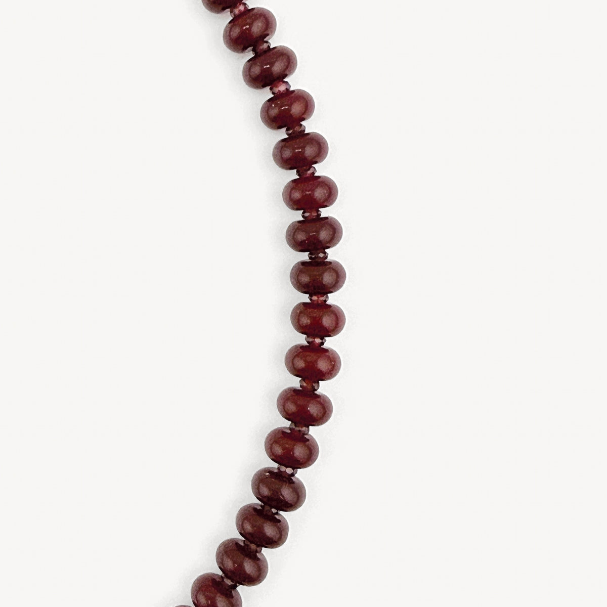 Close-up of the burgundy rondelles and garnet accents on the Lulu Necklace in Burgundy