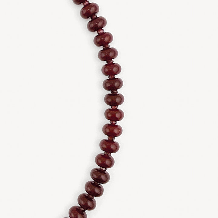 Close-up of the burgundy rondelles and garnet accents on the Lulu Necklace in Burgundy