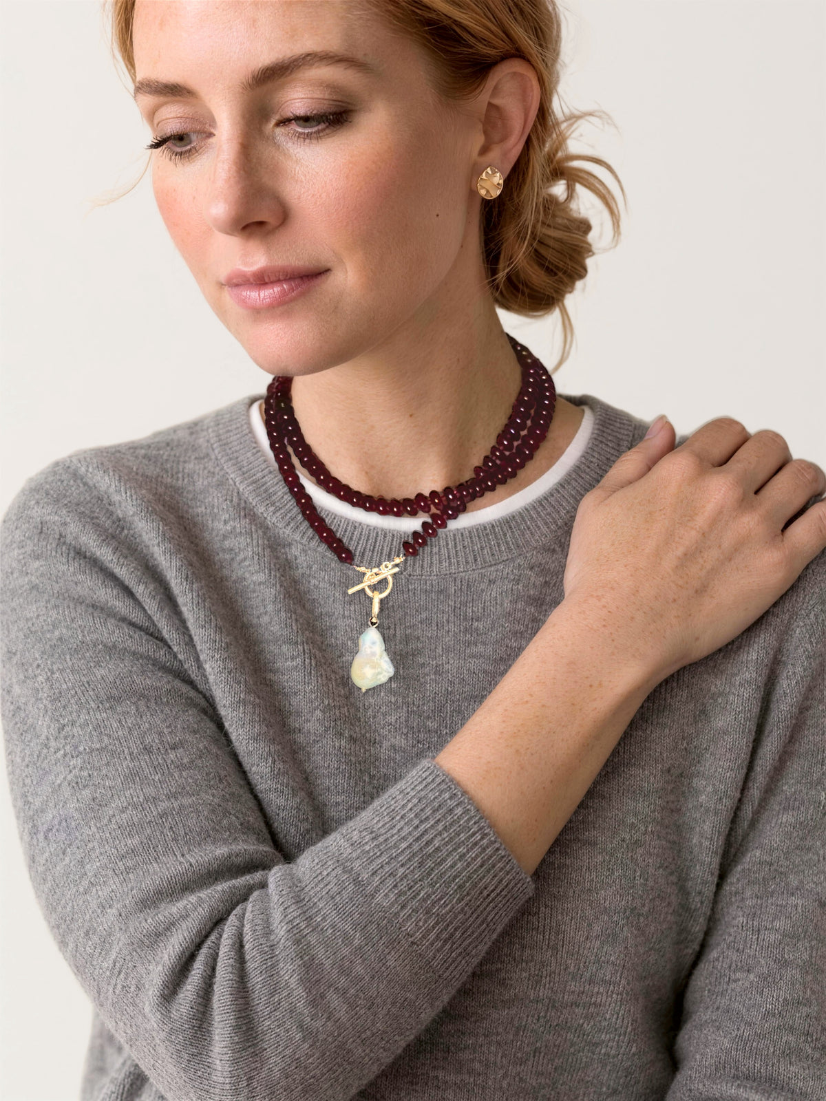 Lulu Necklace in Burgundy, Long, wrapped twice at the collarbone on a model