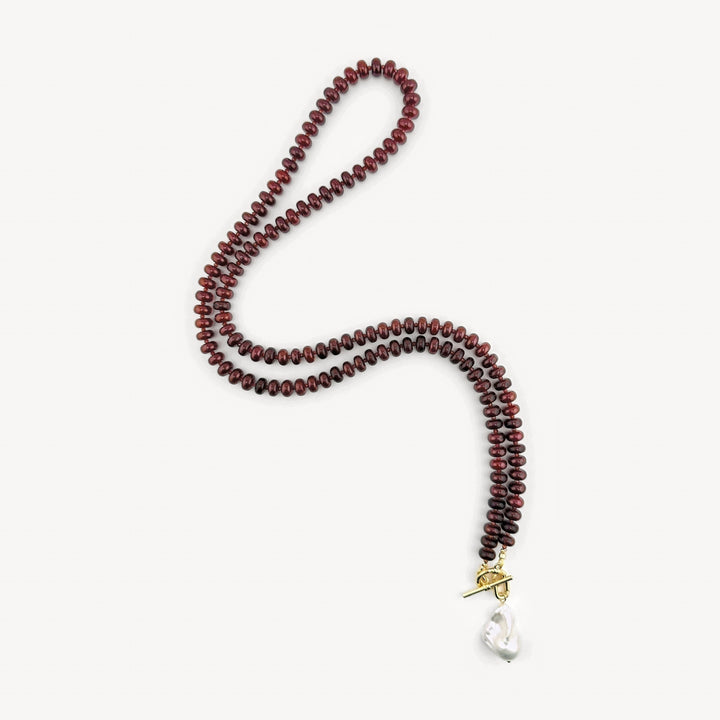 Lulu Necklace in Burgundy, Long, 32-inch burgundy rondelle strand shown with the cultured baroque pearl charm