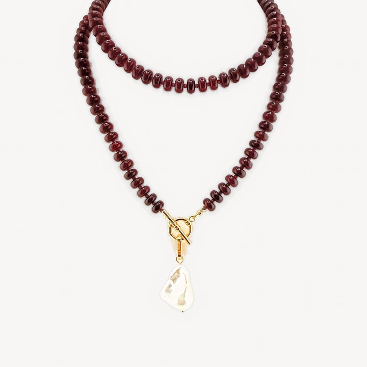 Lulu Necklace in Burgundy, Long, with the toggle at the front and the cultured baroque pearl charm