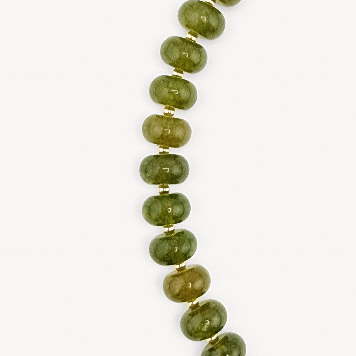 Close-up of the olive rondelles on the Lulu Necklace in Burgundy and Olive