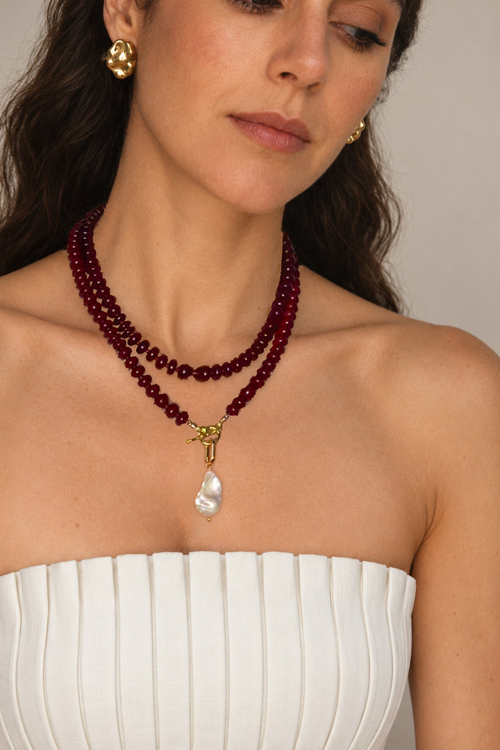 Lulu Necklace in Burgundy worn doubled, model looking to the side