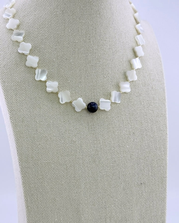 Back view showing the 18k gold-plated lobster clasp on the mother of pearl and kyanite necklace