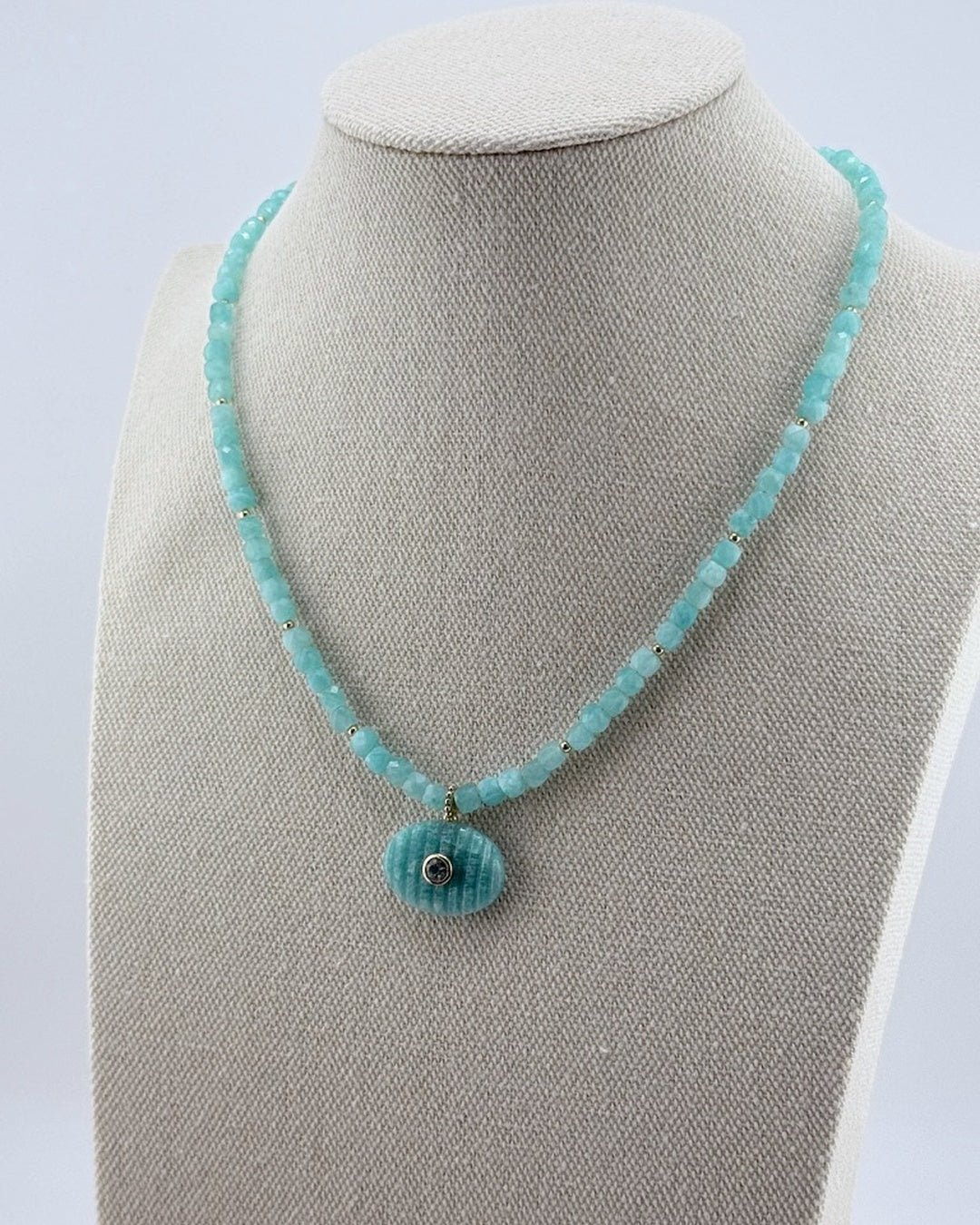 Small amazonite pendant necklace, second angled view on the display bust