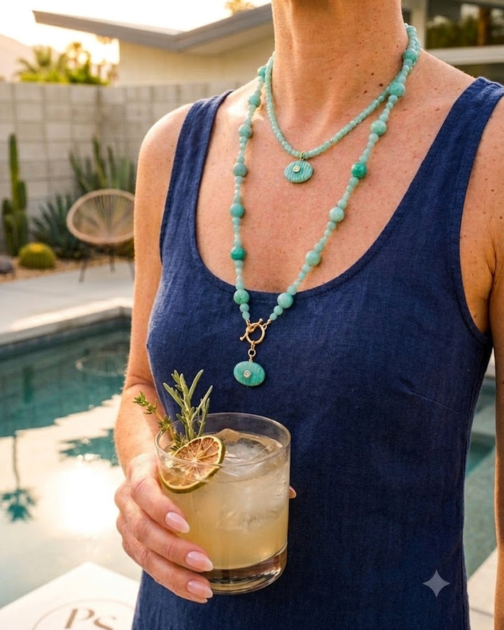 the Amazonite Bubble Necklace layered with the shorter Small Amazonite Pendant Necklace on a navy dress, poolside