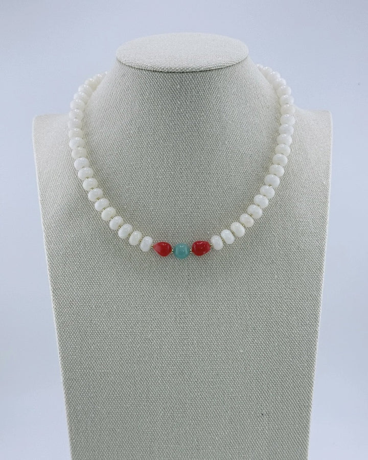 White jade necklace with gold accents and a coral-and-amazonite center, front view