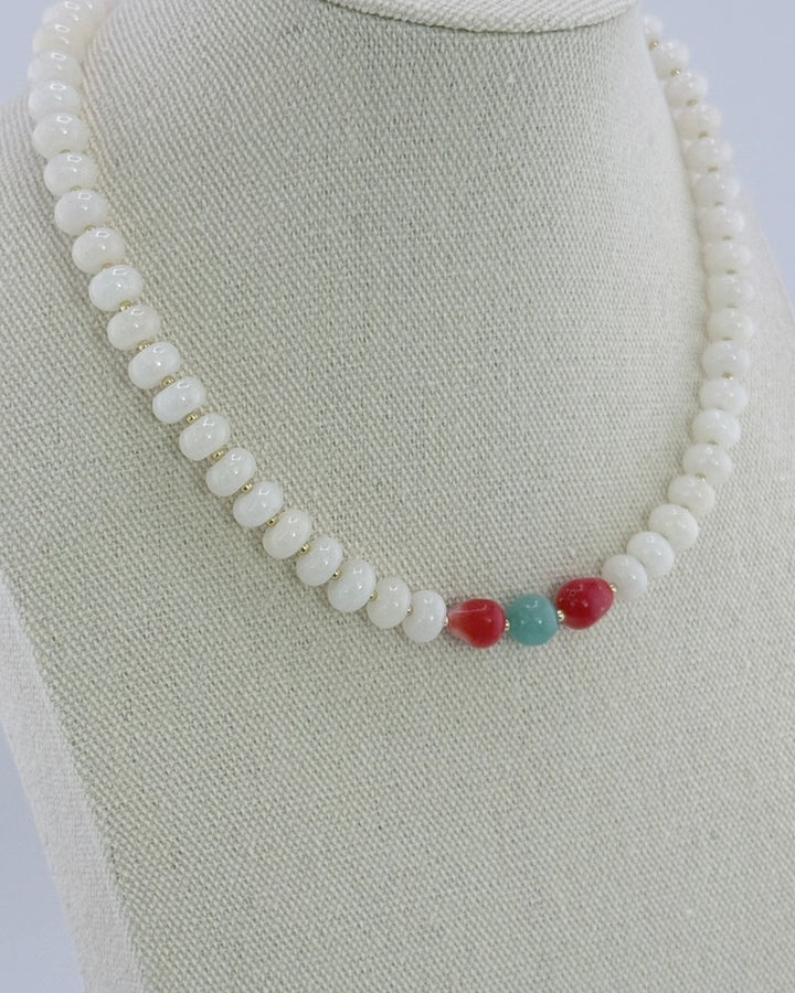 White jade and coral necklace, angled view