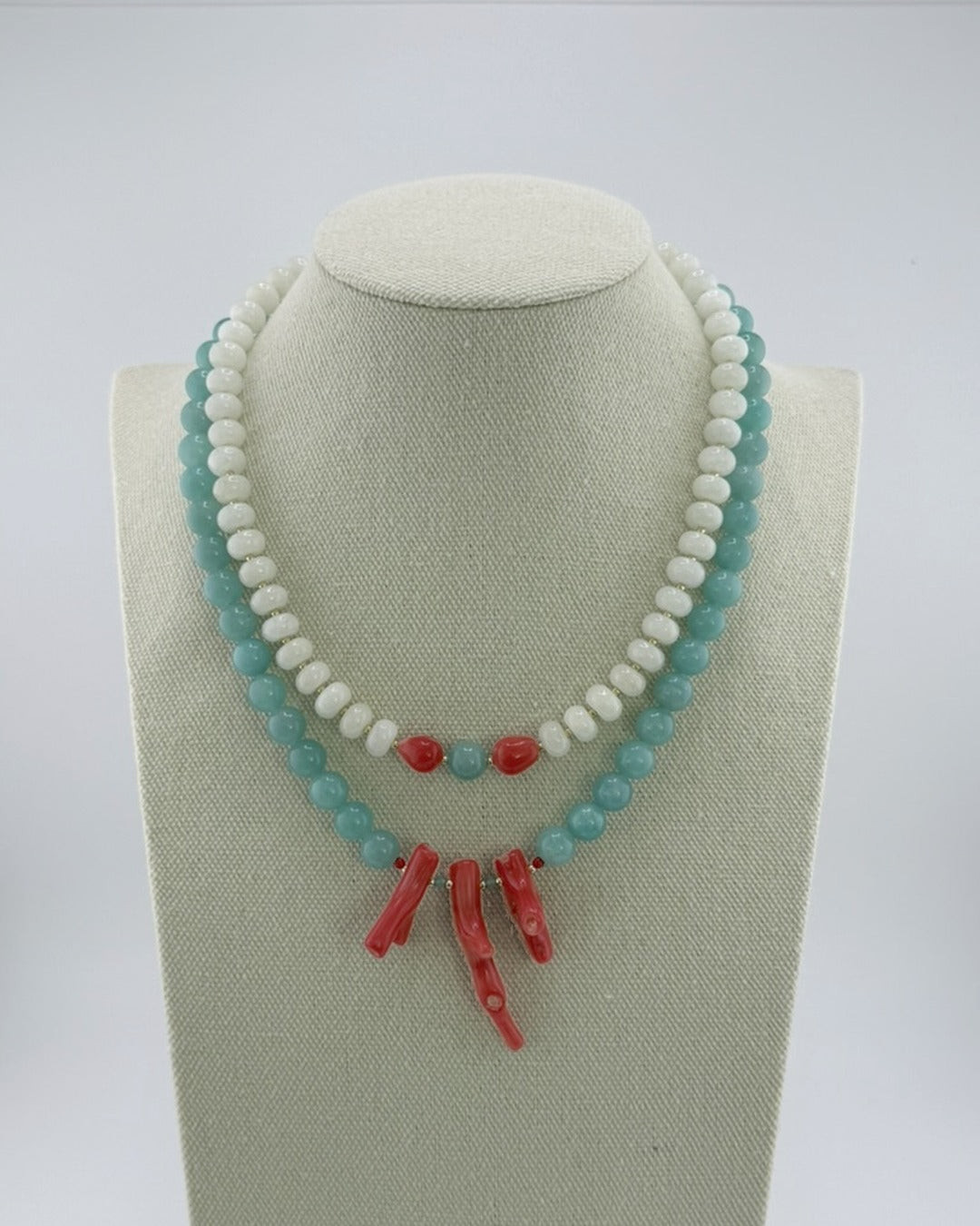 White jade and coral necklace shown layered with the amazonite and coral necklace, which is sold separately