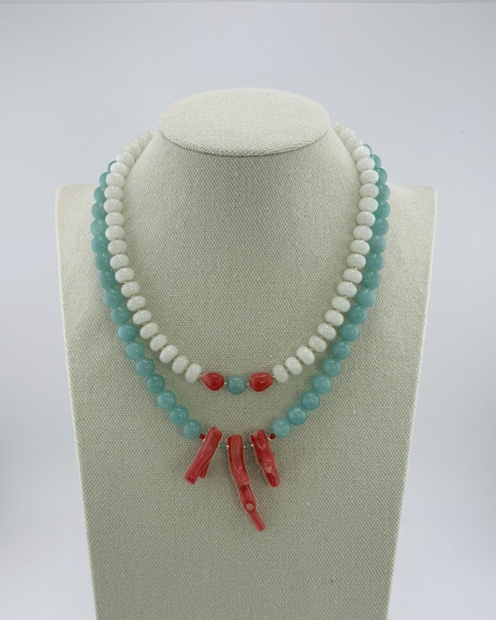 White jade and coral necklace shown layered with the amazonite and coral necklace, which is sold separately